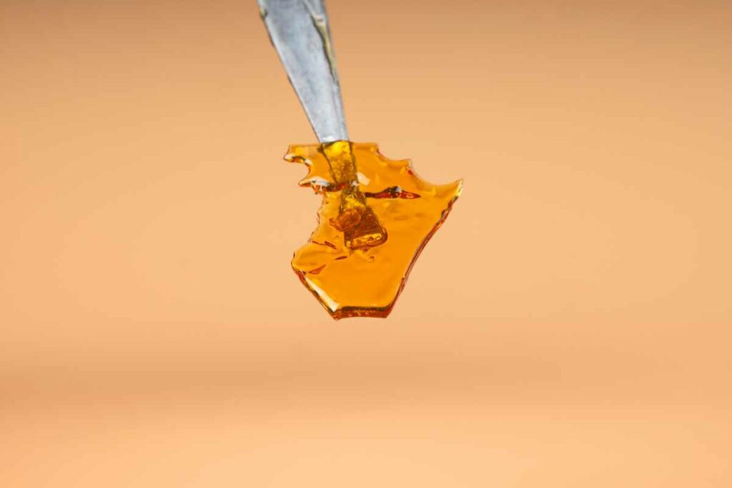 Cannabis shatter on a dab stick